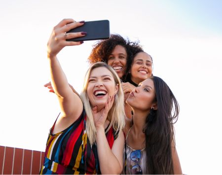 Friends taking group selfie